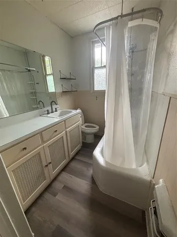 a spacious bathroom with a double vanity sink and a mirror