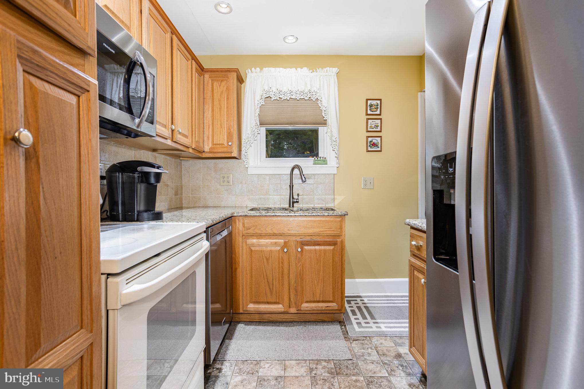 29 Maple Avenue Hershey, PA 17033 - Photo 12 of 32 a kitchen with stainless steel appliances a refrigerator sink and cabinets