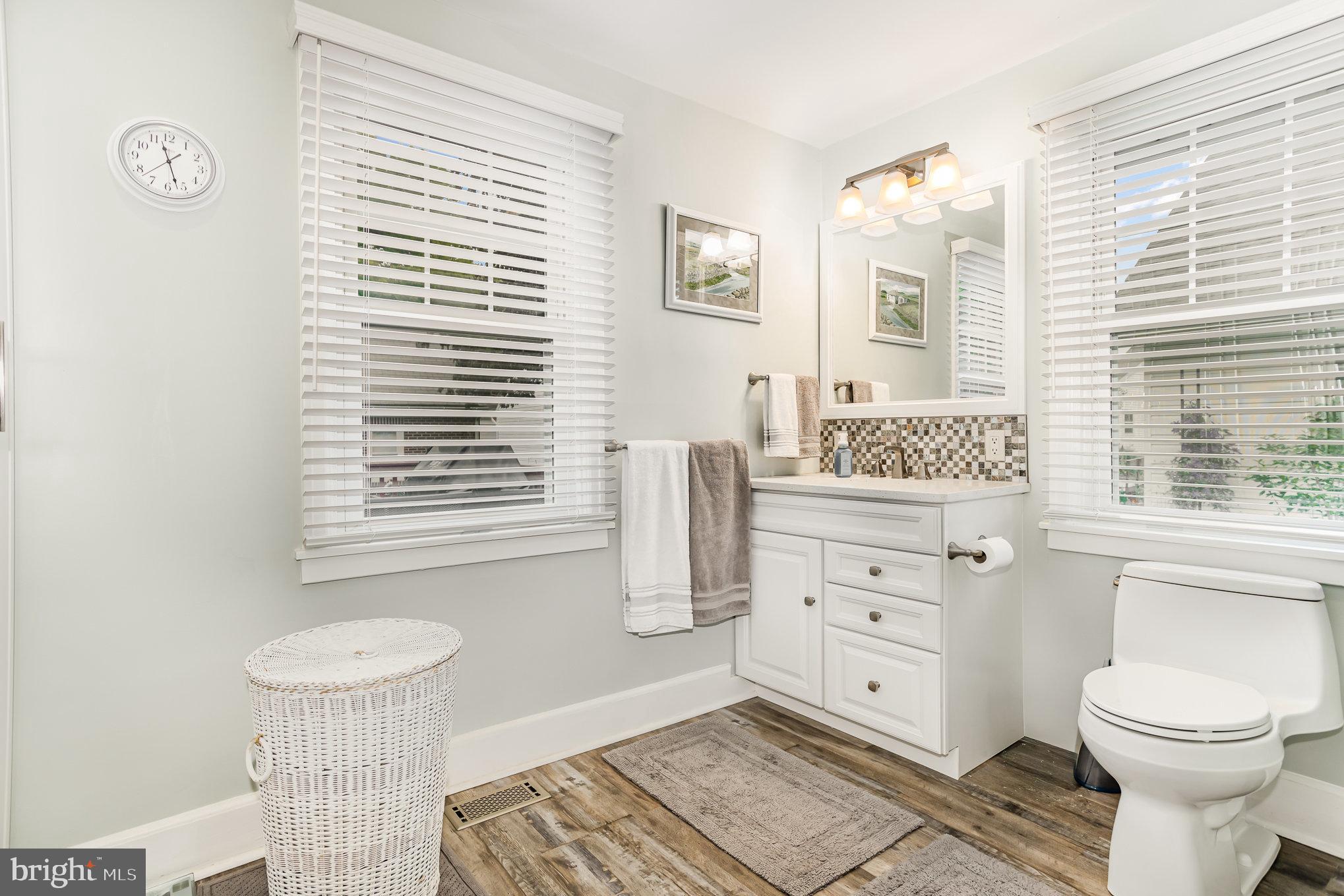 29 Maple Avenue Hershey, PA 17033 - Photo 16 of 32 a bathroom with a toilet a sink and a window