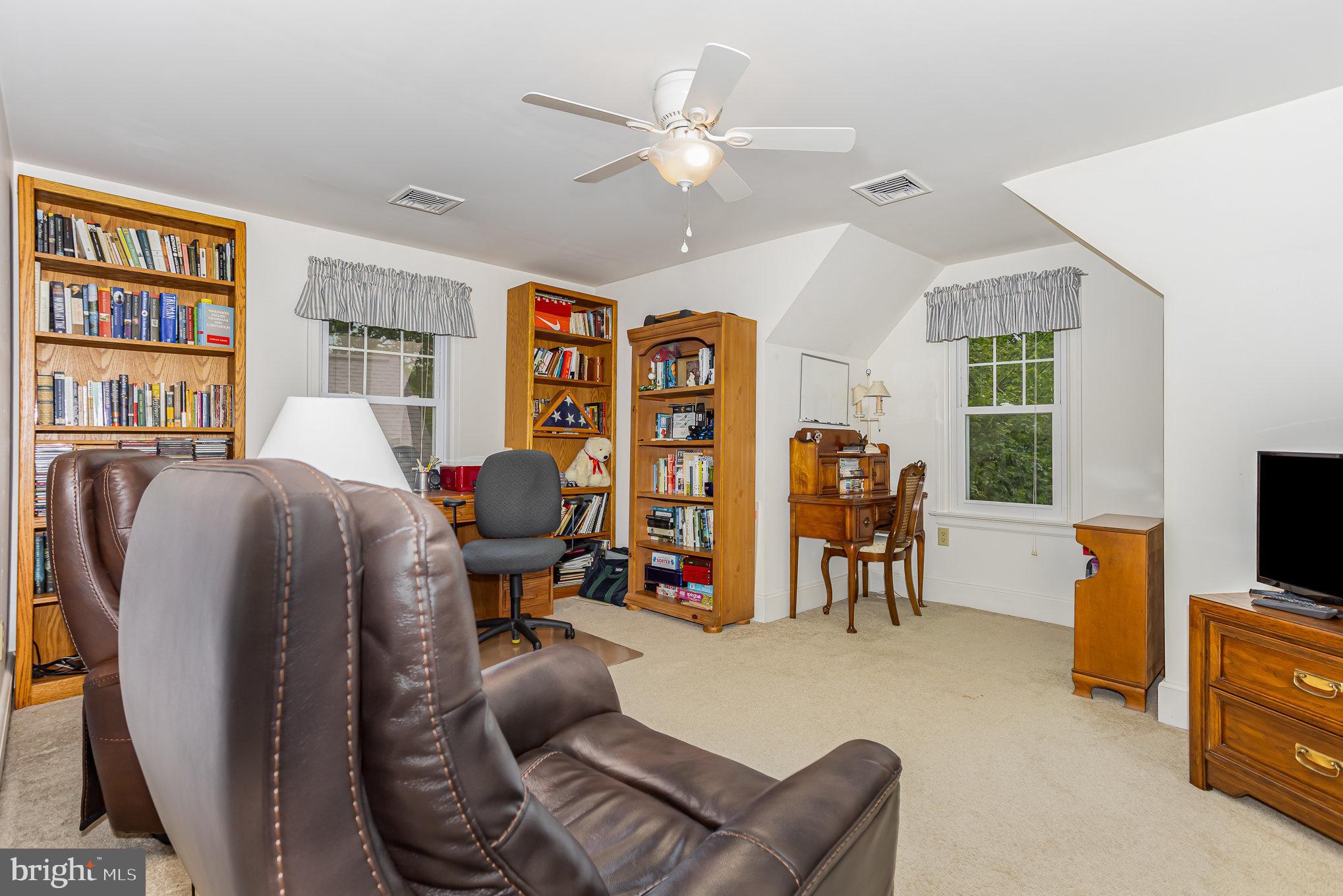 29 Maple Avenue Hershey, PA 17033 - Photo 22 of 32 a living room with furniture and a flat screen tv