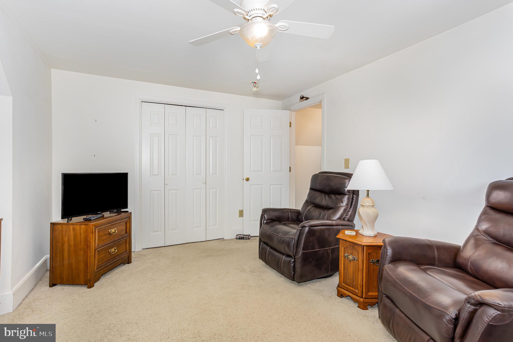 29 Maple Avenue Hershey, PA 17033 - Photo 23 of 32 a living room with furniture and a flat screen tv
