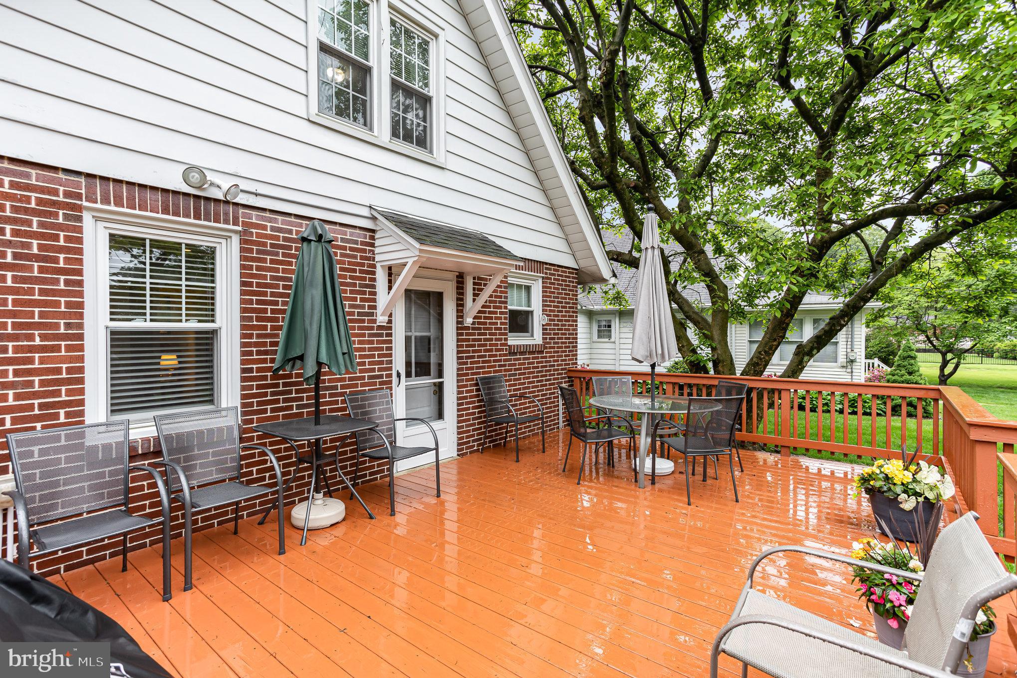 29 Maple Avenue Hershey, PA 17033 - Photo 26 of 32 a view of a patio with table and chairs with wooden floor and fence