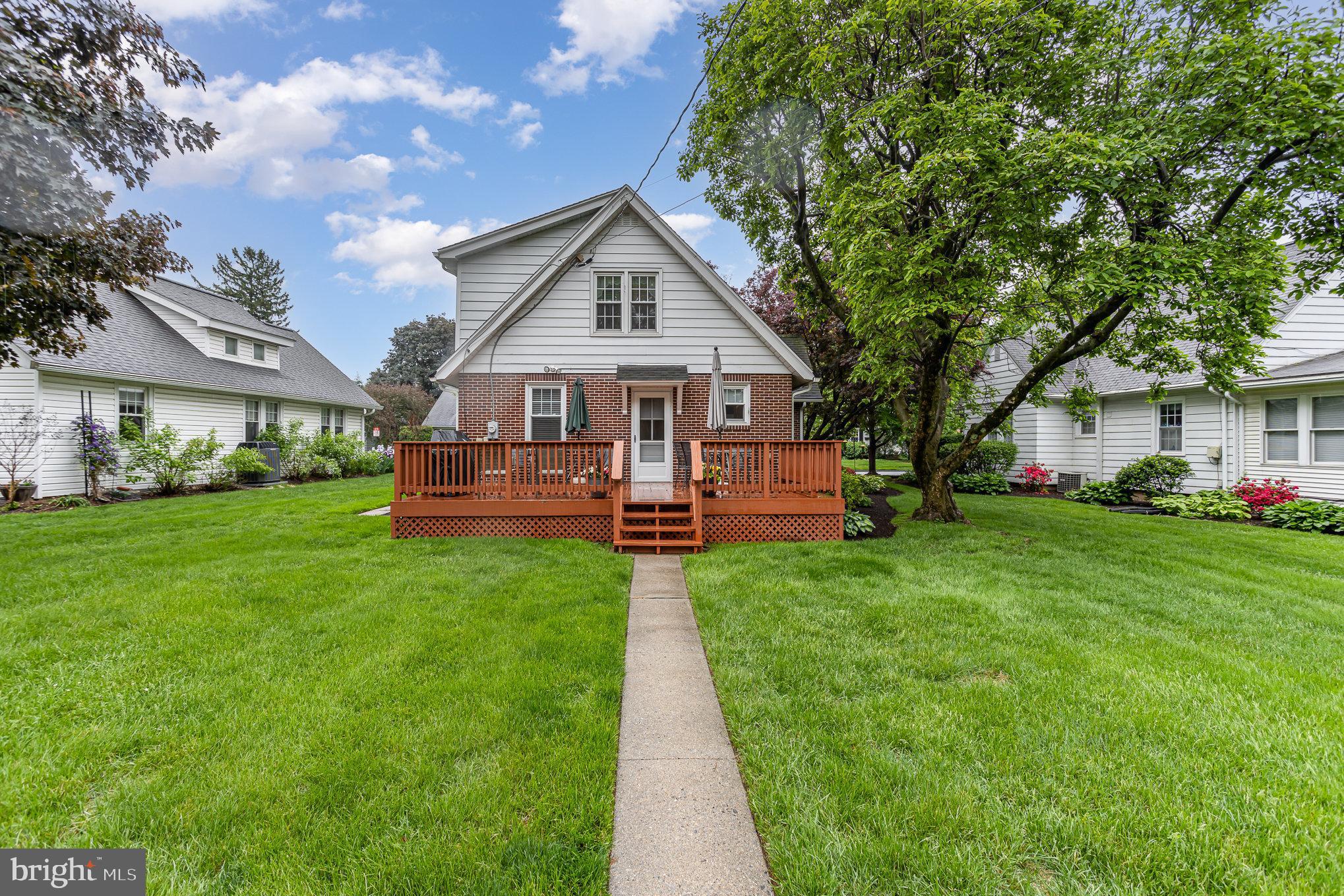29 Maple Avenue Hershey, PA 17033 - Photo 27 of 32 a view of a house with a big yard potted plants and large tree