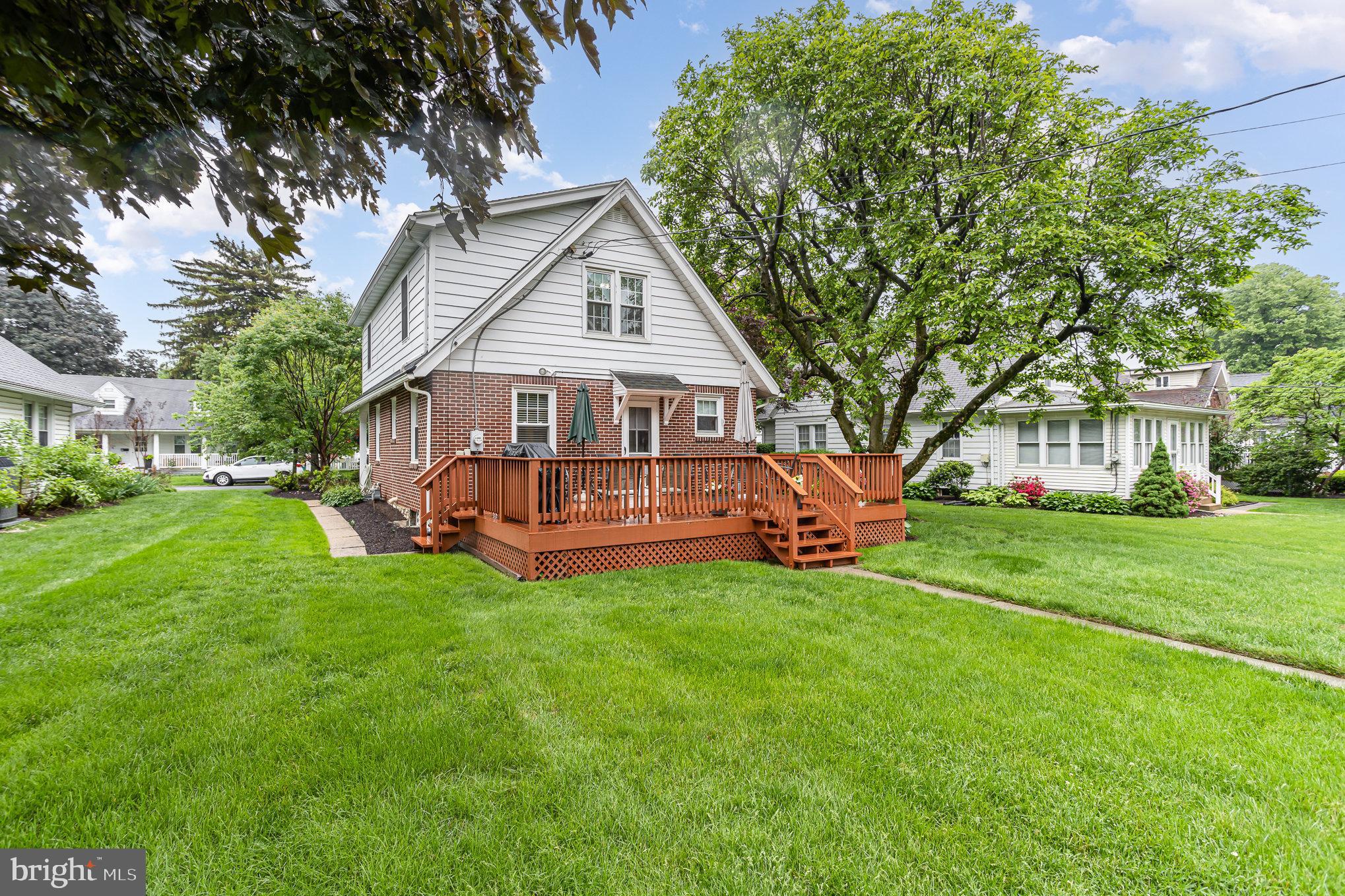 29 Maple Avenue Hershey, PA 17033 - Photo 29 of 32 a view of a house with a big yard potted plants and large tree