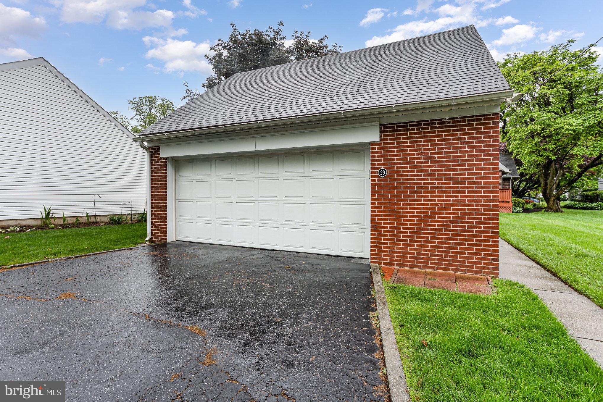 29 Maple Avenue Hershey, PA 17033 - Photo 30 of 32 a front view of a house with a yard and garage
