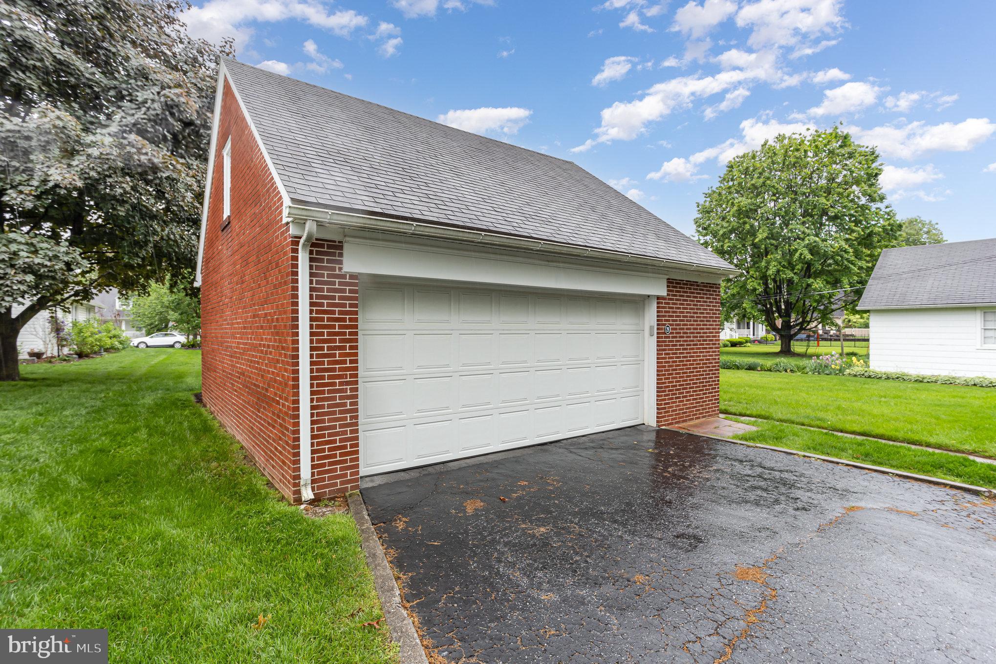 29 Maple Avenue Hershey, PA 17033 - Photo 31 of 32 a front view of a house with a yard and garage