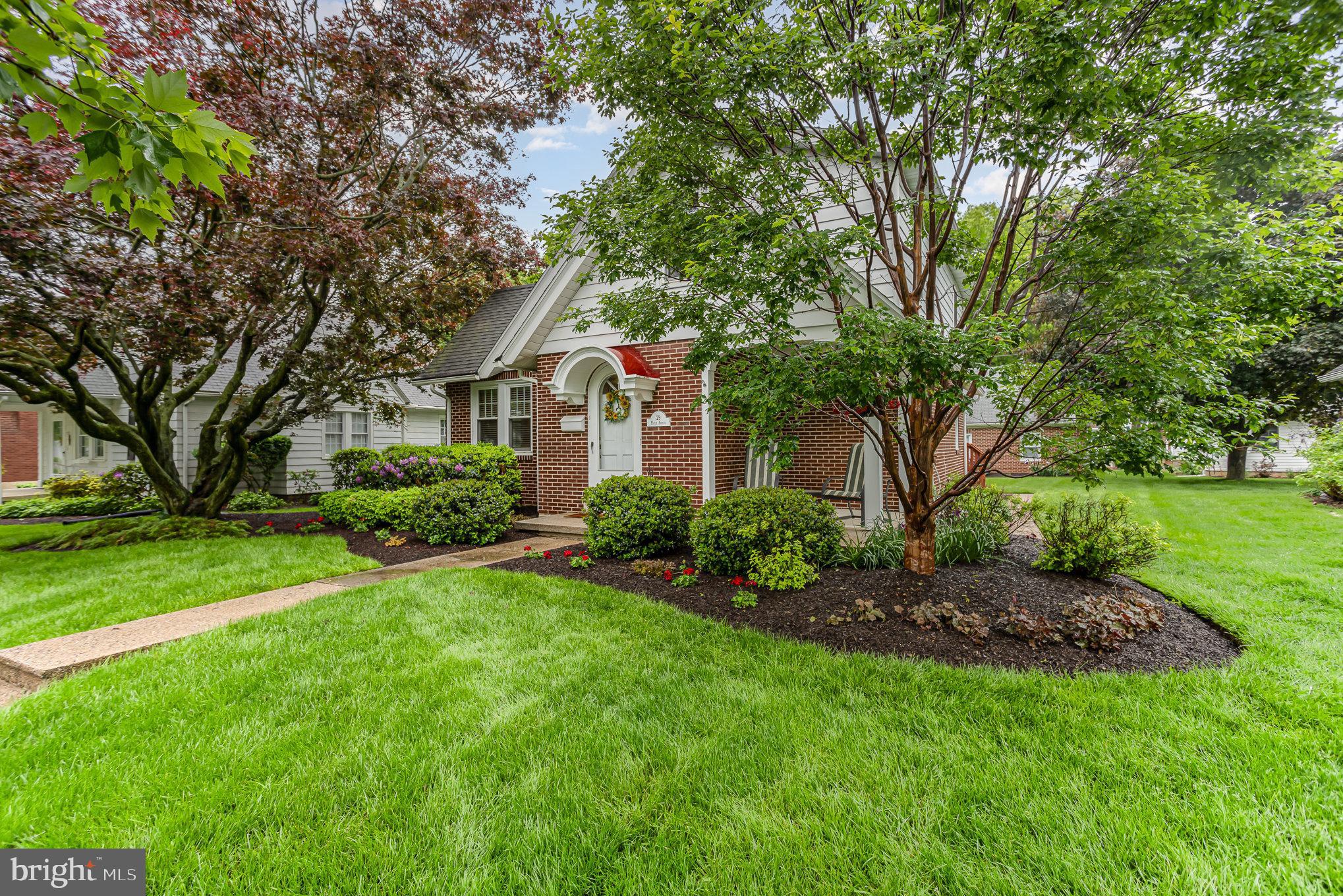 29 Maple Avenue Hershey, PA 17033 - Photo 4 of 32 a front view of a house with a garden