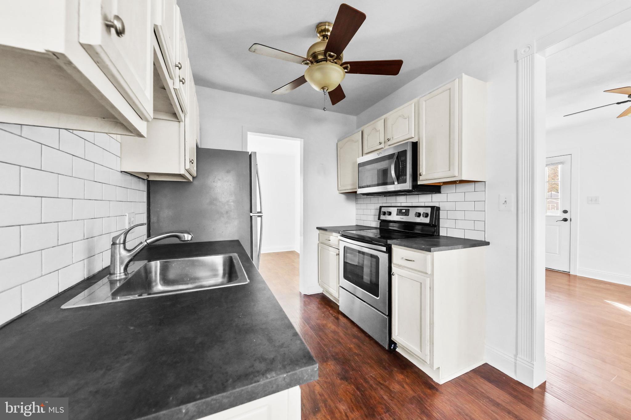 323 3rd Avenue Lindenwold, NJ 08021 - Photo 11 of 34 Modern kitchen with sleek finishes.