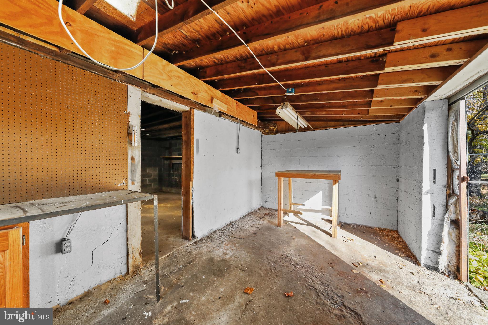 323 3rd Avenue Lindenwold, NJ 08021 - Photo 29 of 34 Spacious unfinished garage with natural light.
