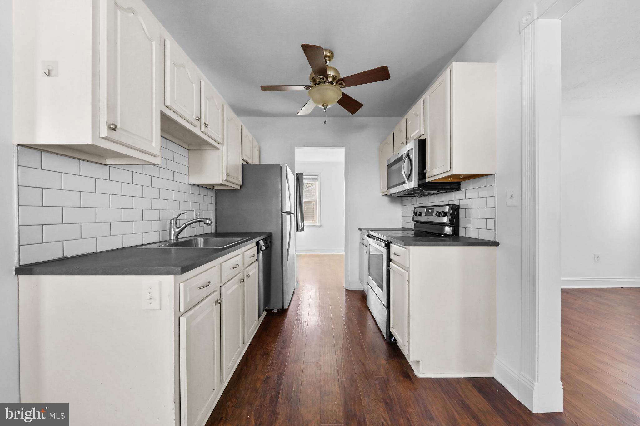 323 3rd Avenue Lindenwold, NJ 08021 - Photo 9 of 34 Modern kitchen with sleek finishes.