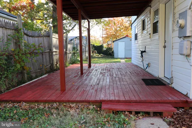 a view of a backyard with sitting area
