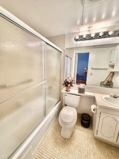 202 Brighton East Boca Raton, FL 33434 - Photo 10 of 37 a bathroom with a granite countertop sink toilet and shower