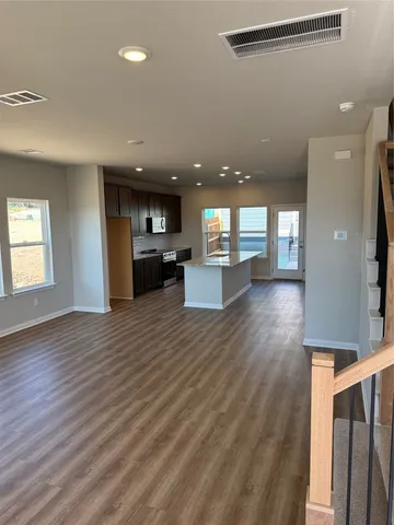 a view of a kitchen and a window