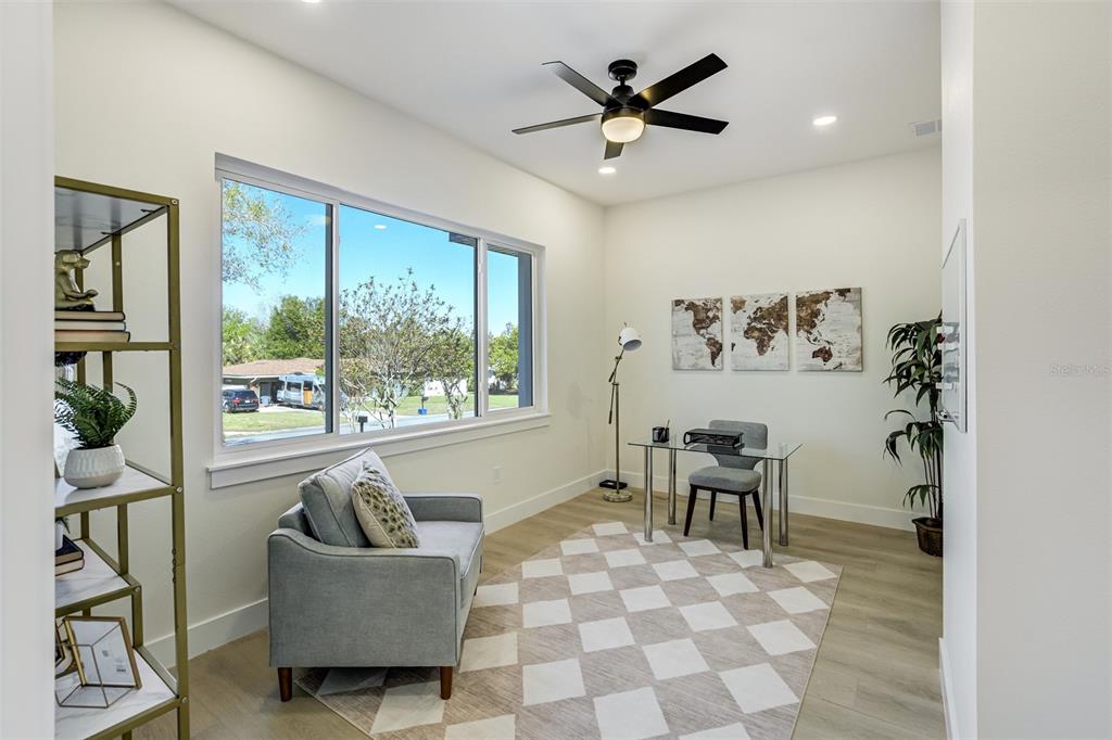 319 Cedar Lane Largo, FL 33770 - Photo 17 of 37 a living room with furniture and a large window