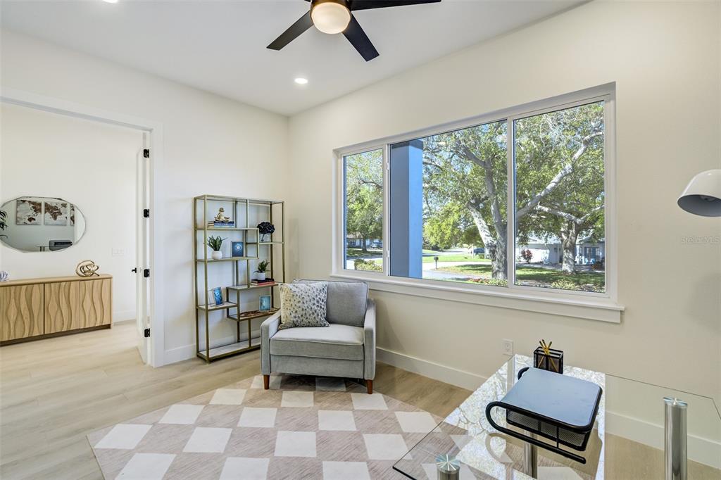 319 Cedar Lane Largo, FL 33770 - Photo 18 of 37 a living room with furniture and a window