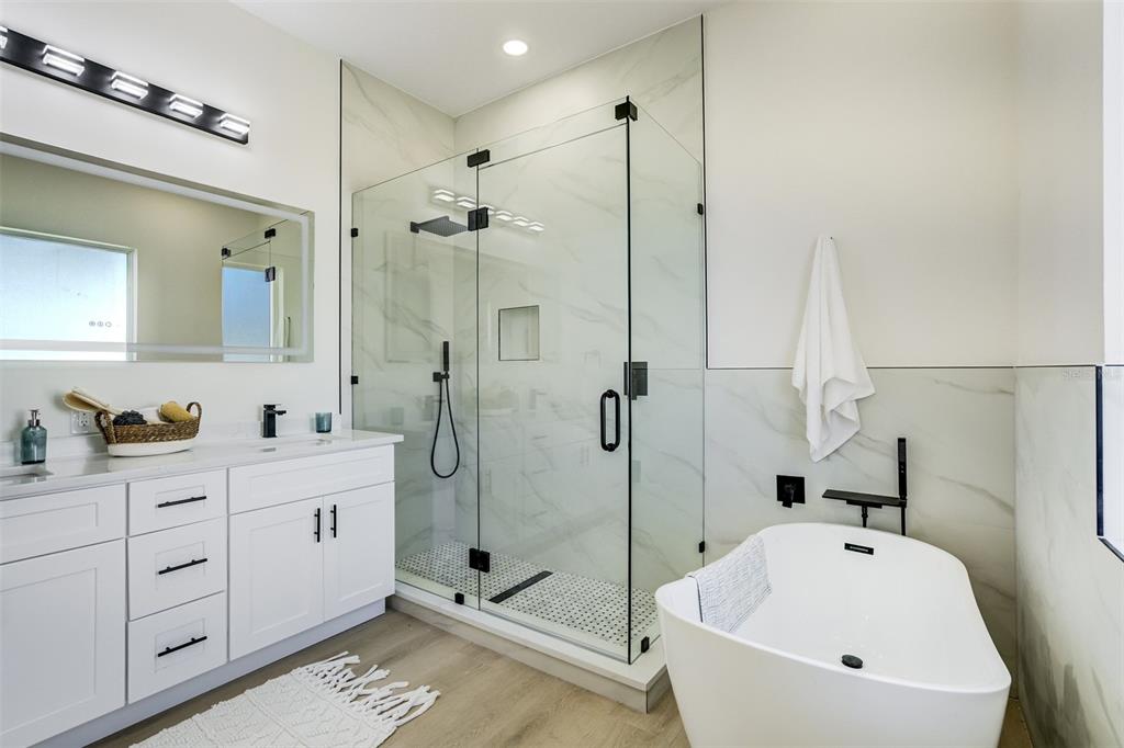 319 Cedar Lane Largo, FL 33770 - Photo 22 of 37 a bathroom with a sink a toilet and shower