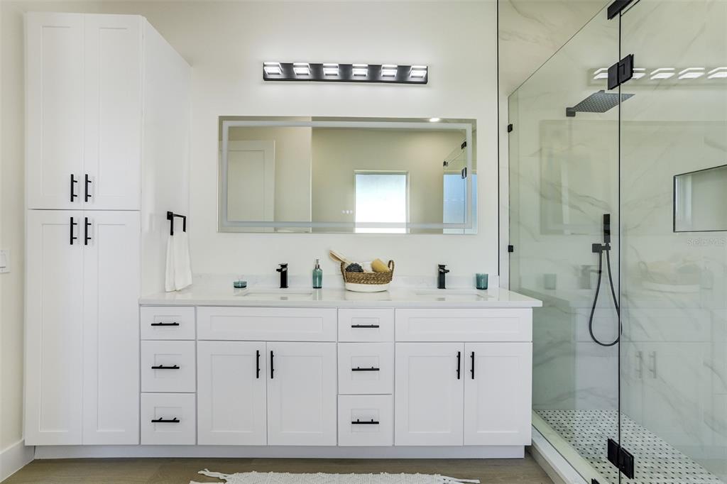 319 Cedar Lane Largo, FL 33770 - Photo 23 of 37 a bathroom with a double vanity sink mirror and