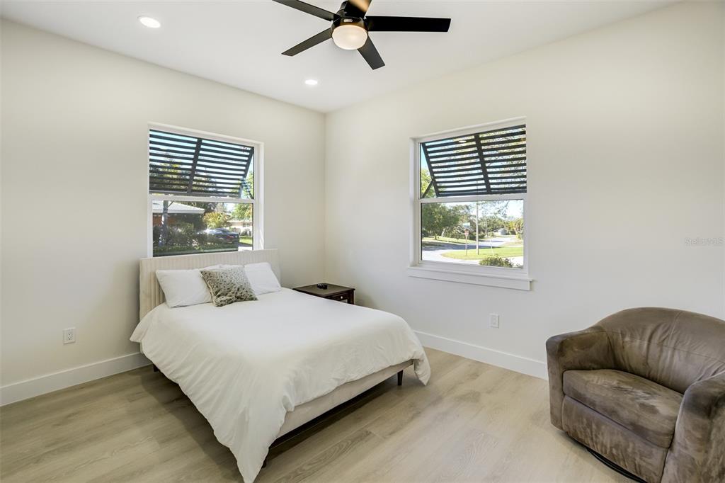 319 Cedar Lane Largo, FL 33770 - Photo 25 of 37 a bedroom with a bed and window