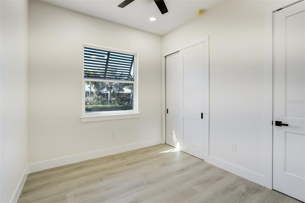 319 Cedar Lane Largo, FL 33770 - Photo 26 of 37 a view of an empty room with window and closet area