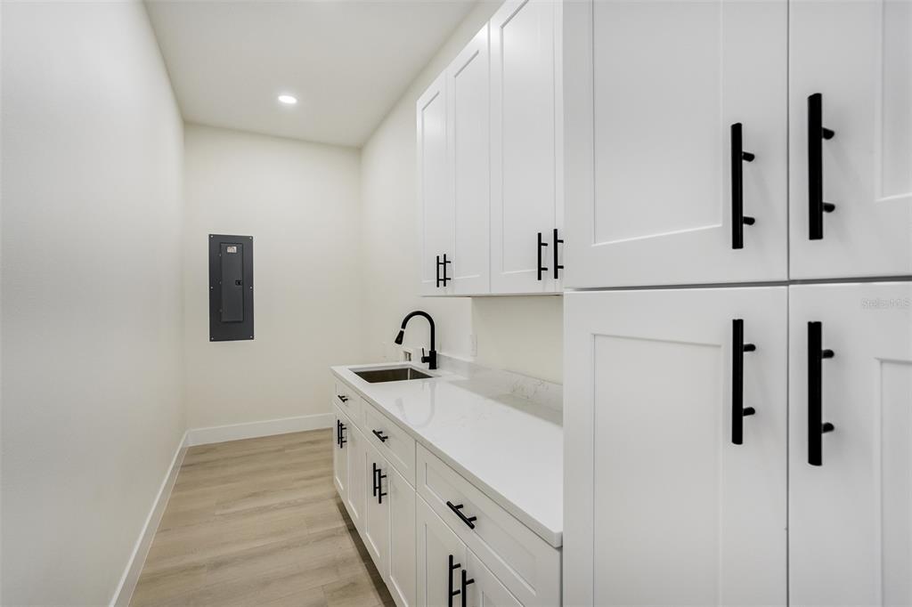 319 Cedar Lane Largo, FL 33770 - Photo 32 of 37 a bathroom with a sink and mirror