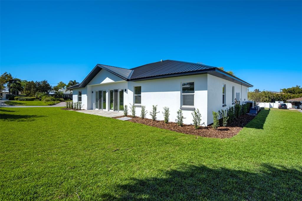 319 Cedar Lane Largo, FL 33770 - Photo 36 of 37 a view of a house with a yard