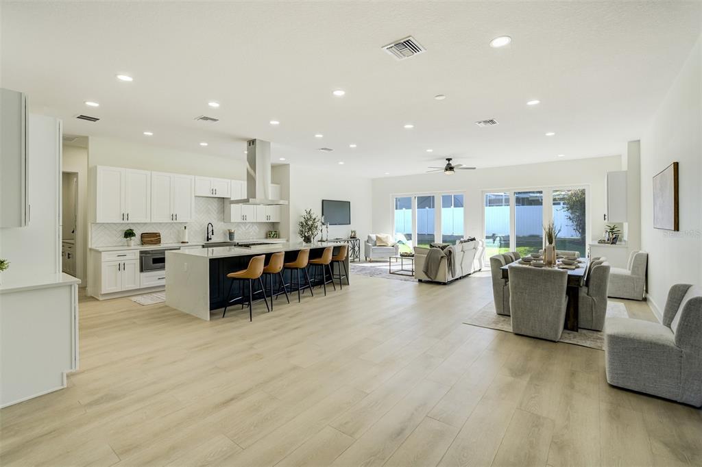 319 Cedar Lane Largo, FL 33770 - Photo 4 of 37 a living room with furniture and kitchen view