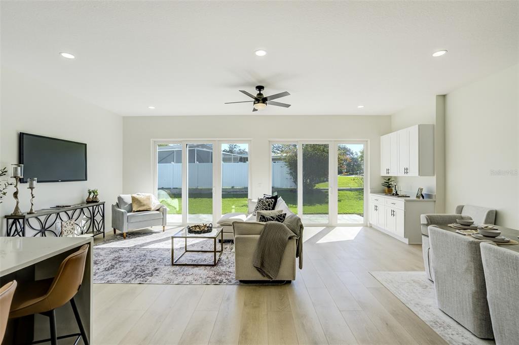 319 Cedar Lane Largo, FL 33770 - Photo 5 of 37 a living room with furniture flat screen tv and a large window