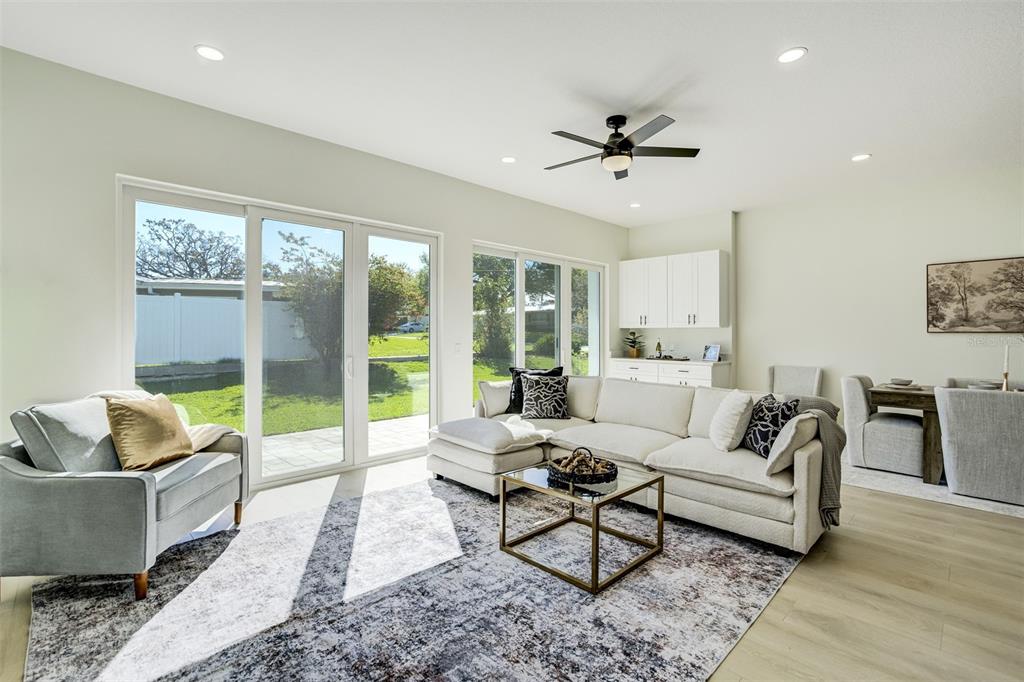 319 Cedar Lane Largo, FL 33770 - Photo 7 of 37 a living room with furniture and a large window