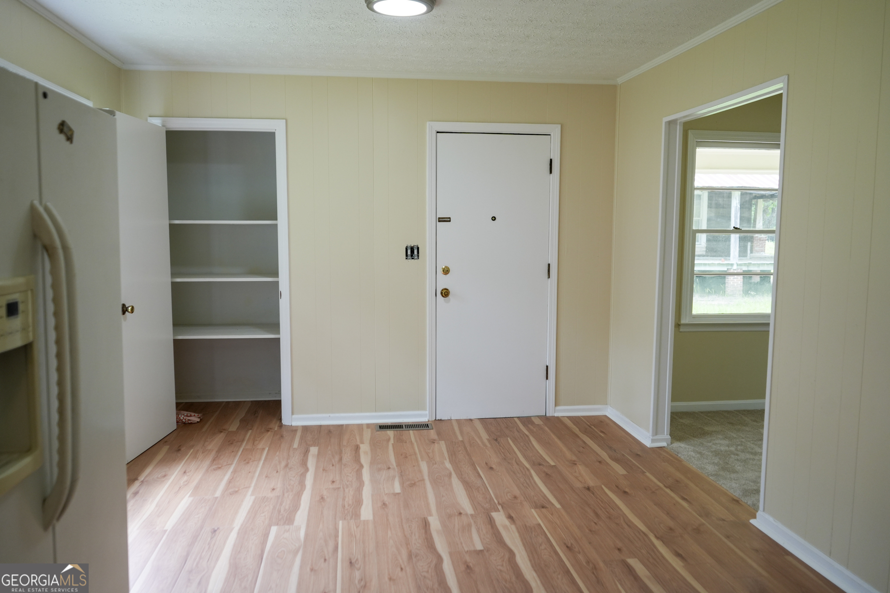 1869 Minter Blue Springs Road Rockledge, GA 30454 - Photo 26 of 45 a view of empty room with wooden floor and fan