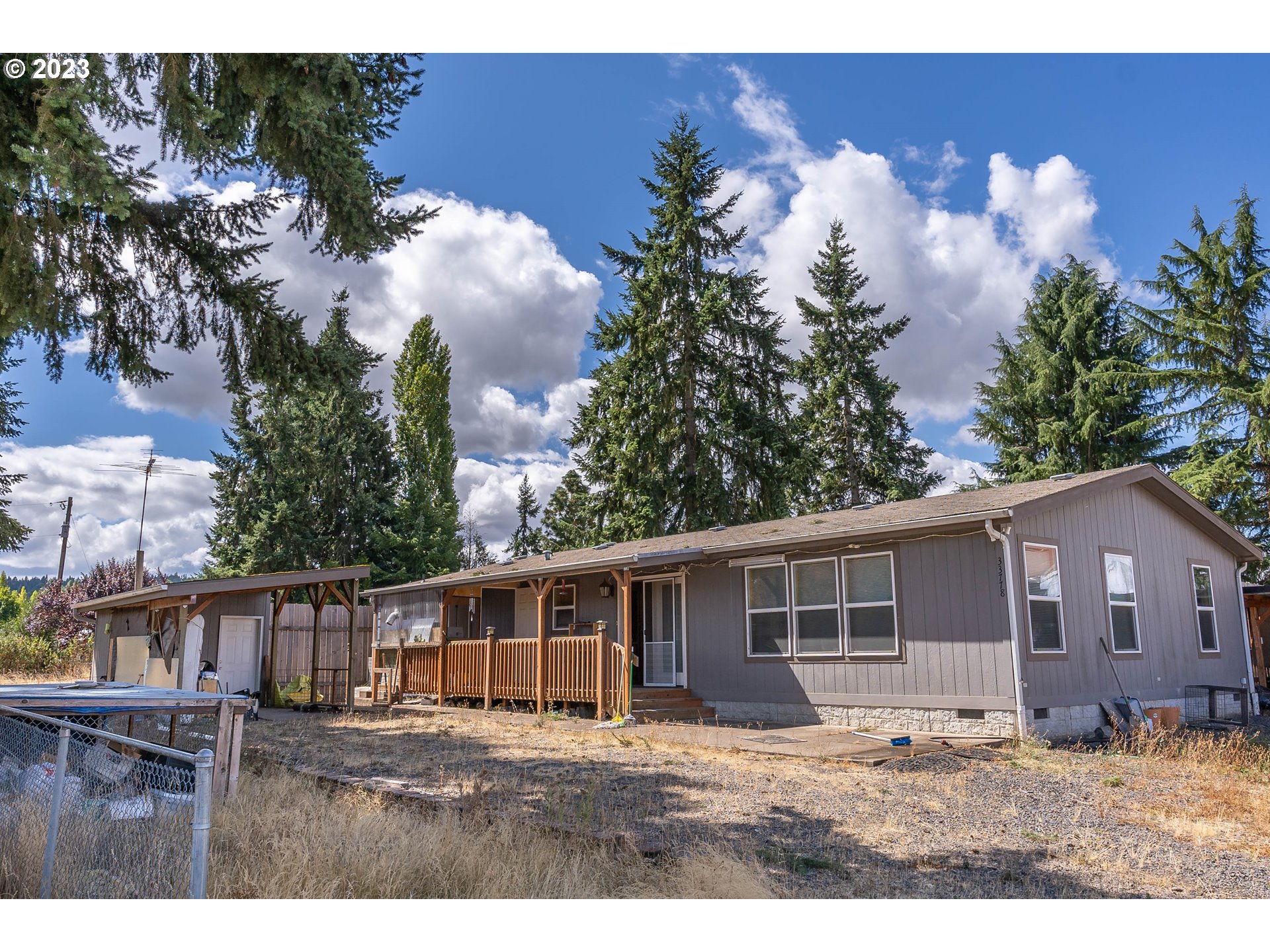 33778 Bond Road Lebanon, OR 97355 - Photo 1 of 12 a backyard of a house with table and chairs