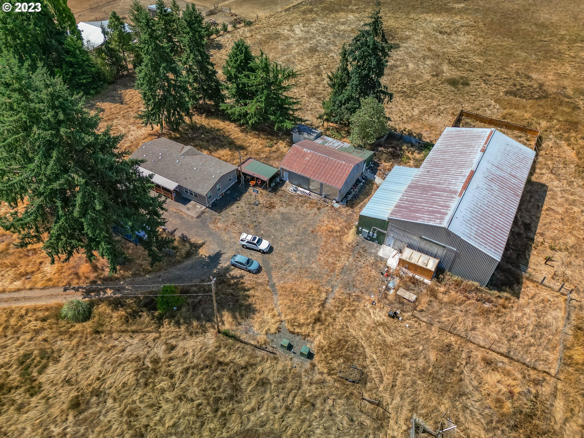 33778 Bond Road Lebanon, OR 97355 - Photo 8 of 12 an aerial view of a house with yard and lake view