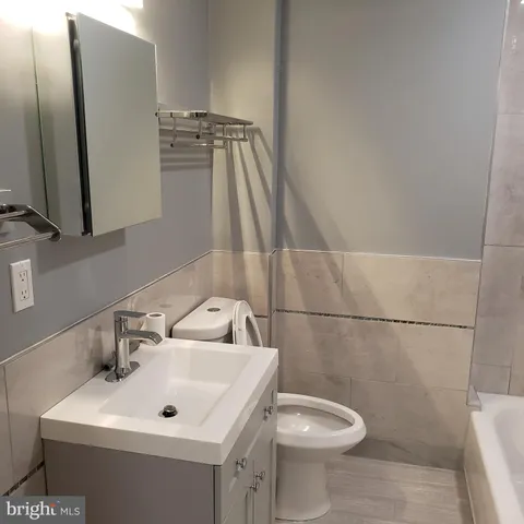 a bathroom with a sink and toilet