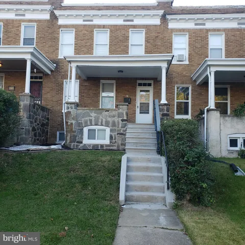 a bathroom with a sink a mirror and vanity