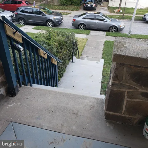 a view of a hallway and wooden floor
