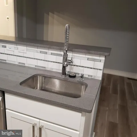 a kitchen with stainless steel appliances a stove a microwave and a refrigerator