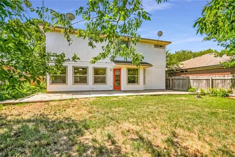 front view of a house with a garden