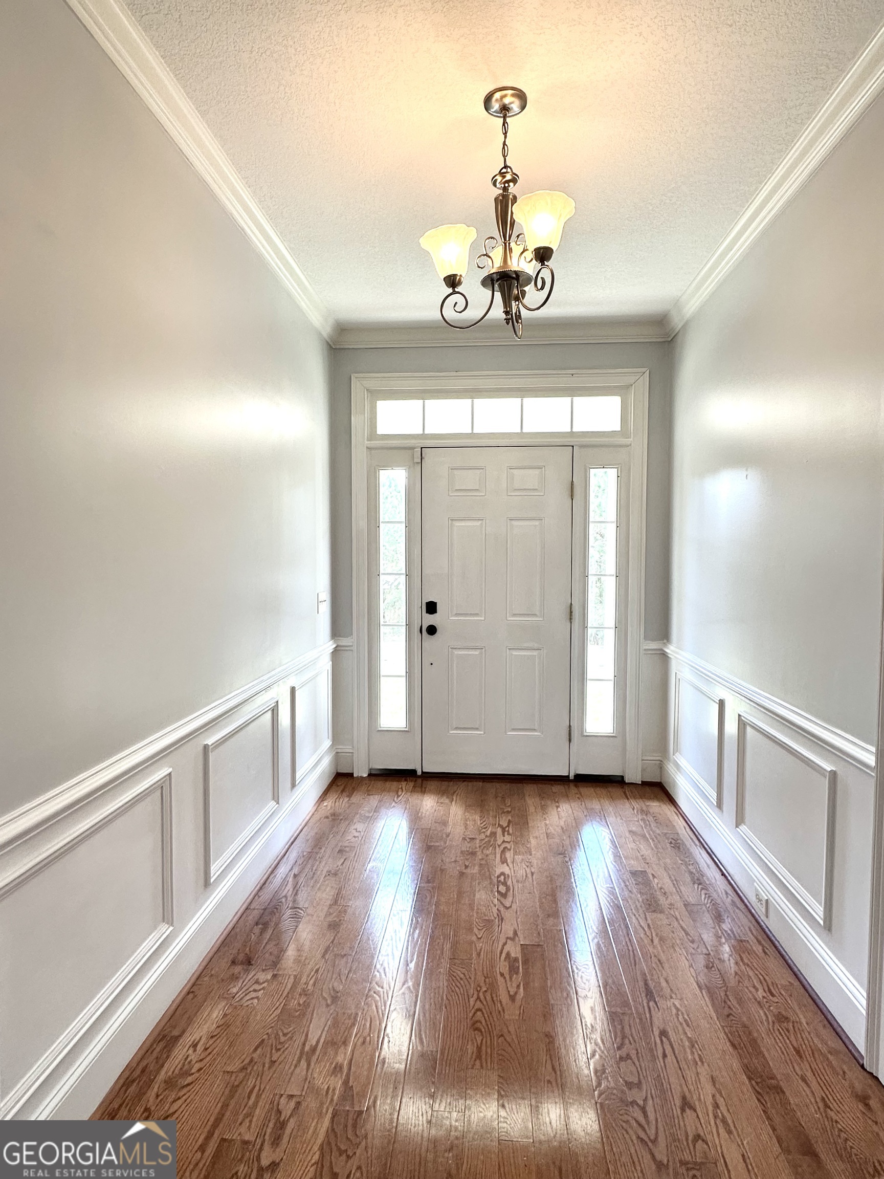 26 Alan Lane Tifton, GA 31793 - Photo 1 of 28 a view of an empty room with wooden floor and a window