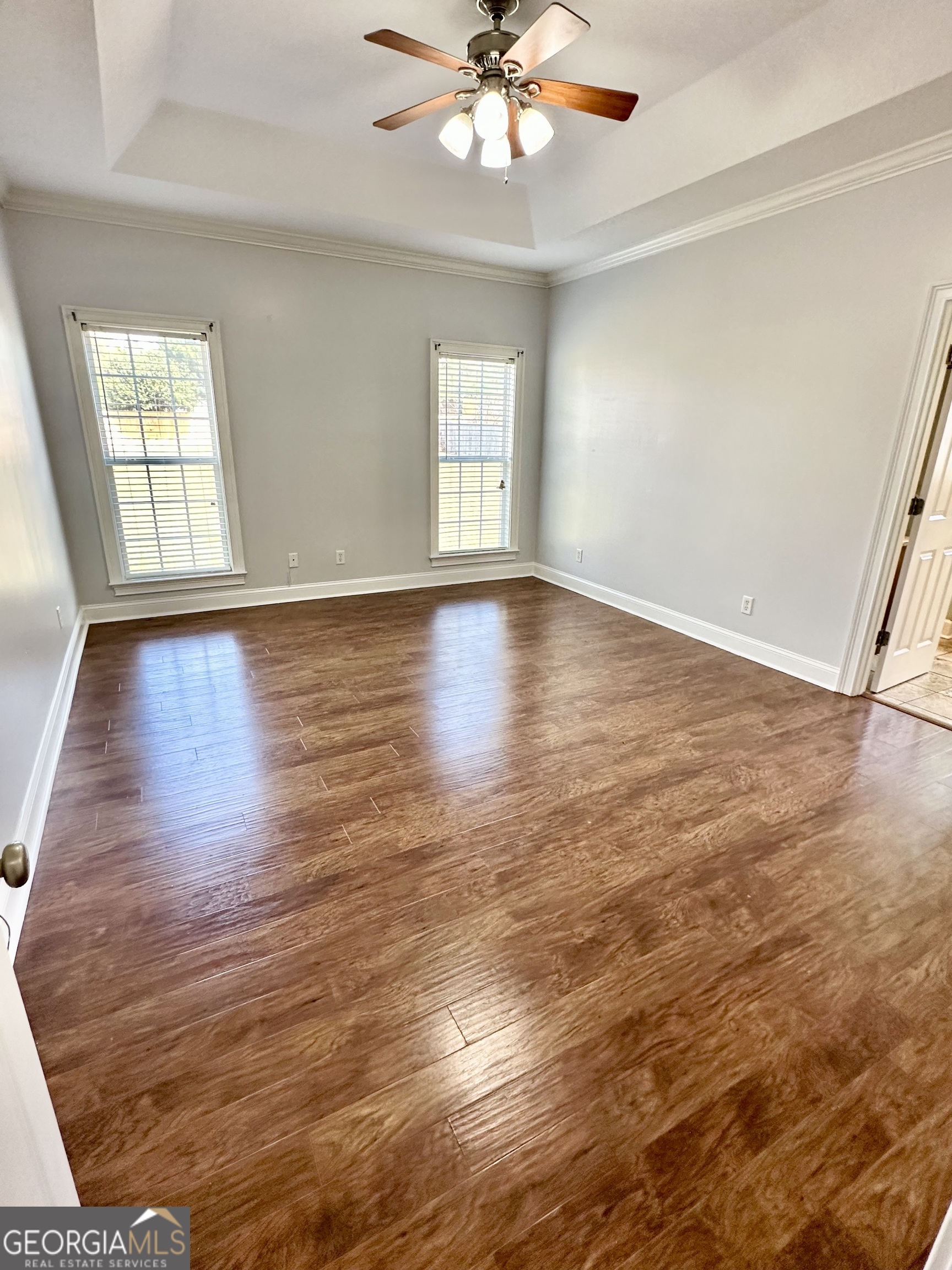 26 Alan Lane Tifton, GA 31793 - Photo 11 of 28 wooden floor in an empty room with a window
