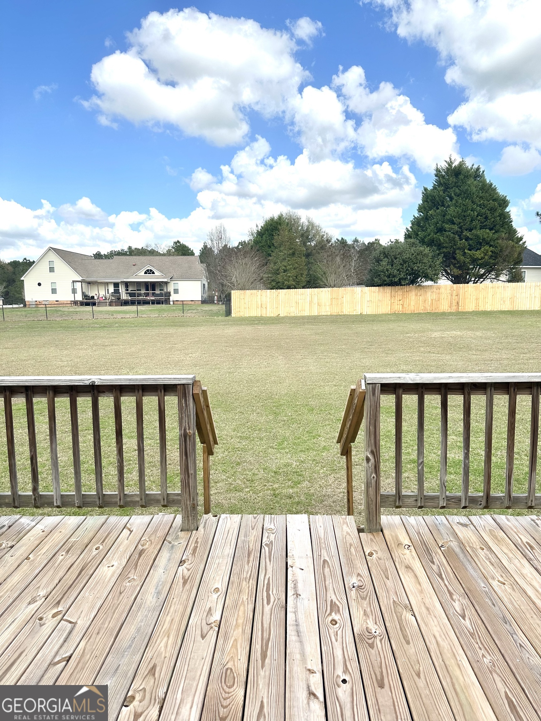 26 Alan Lane Tifton, GA 31793 - Photo 25 of 28 a view of wooden balcony with outdoor space and ocean view