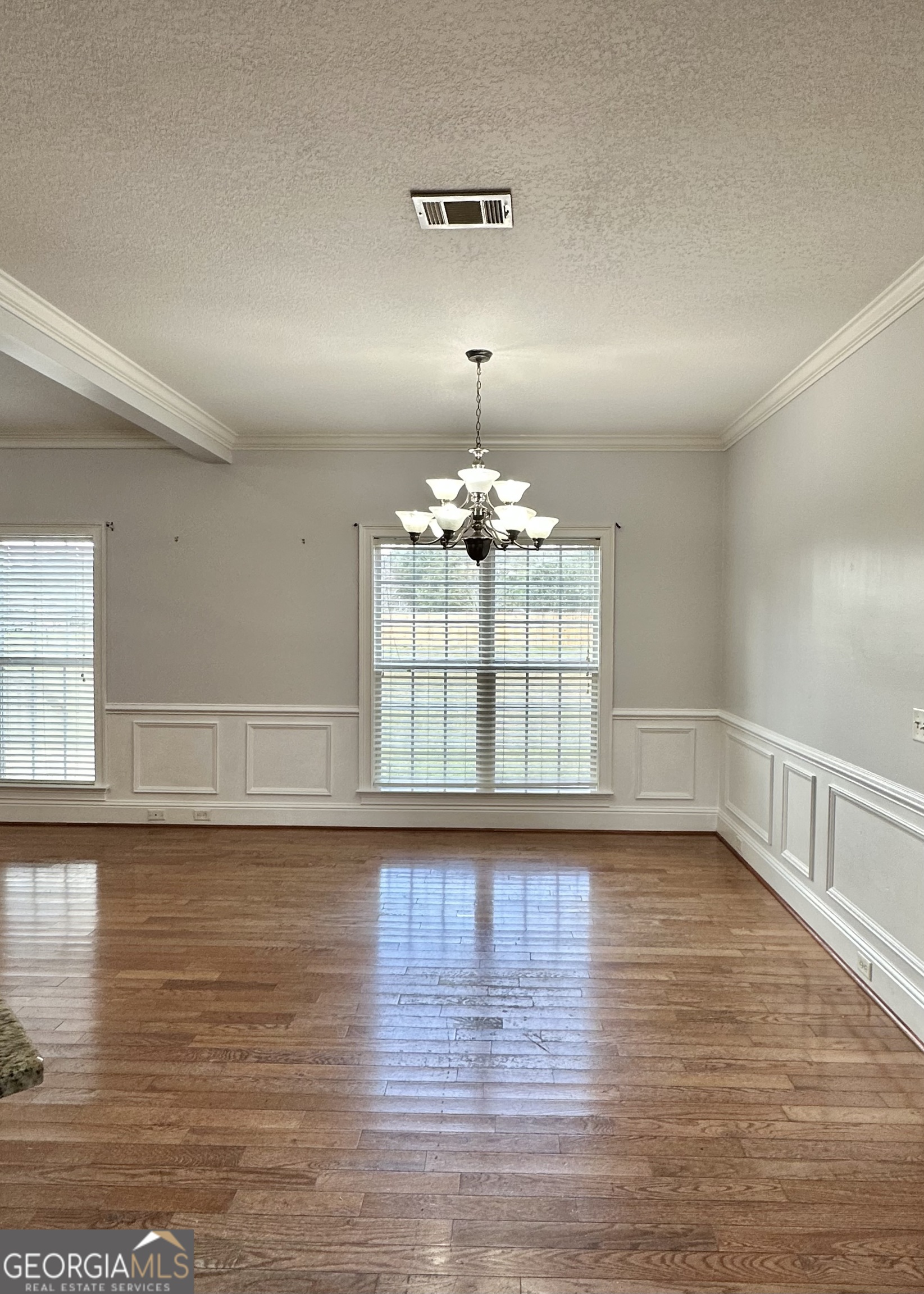 26 Alan Lane Tifton, GA 31793 - Photo 5 of 28 a view of an empty room with wooden floor and a window