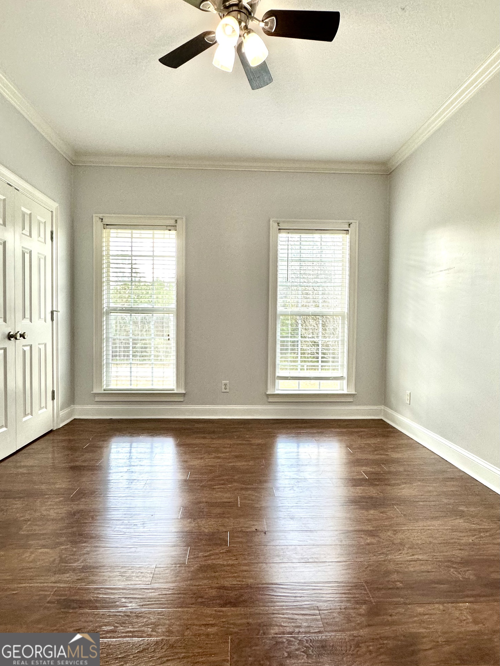 26 Alan Lane Tifton, GA 31793 - Photo 9 of 28 a view of an empty room with wooden floor and a window