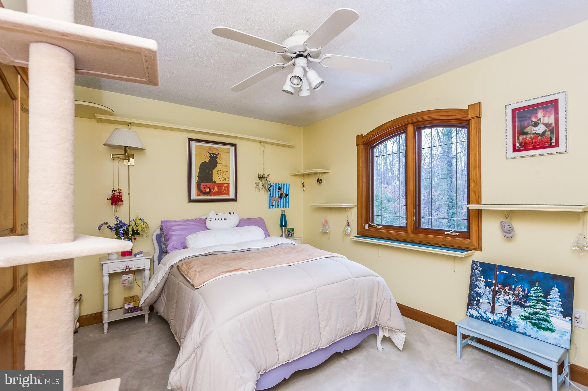4137 Grave Run Road Manchester, MD 21102 - Photo 22 of 30 a bedroom with a bed and a chandelier