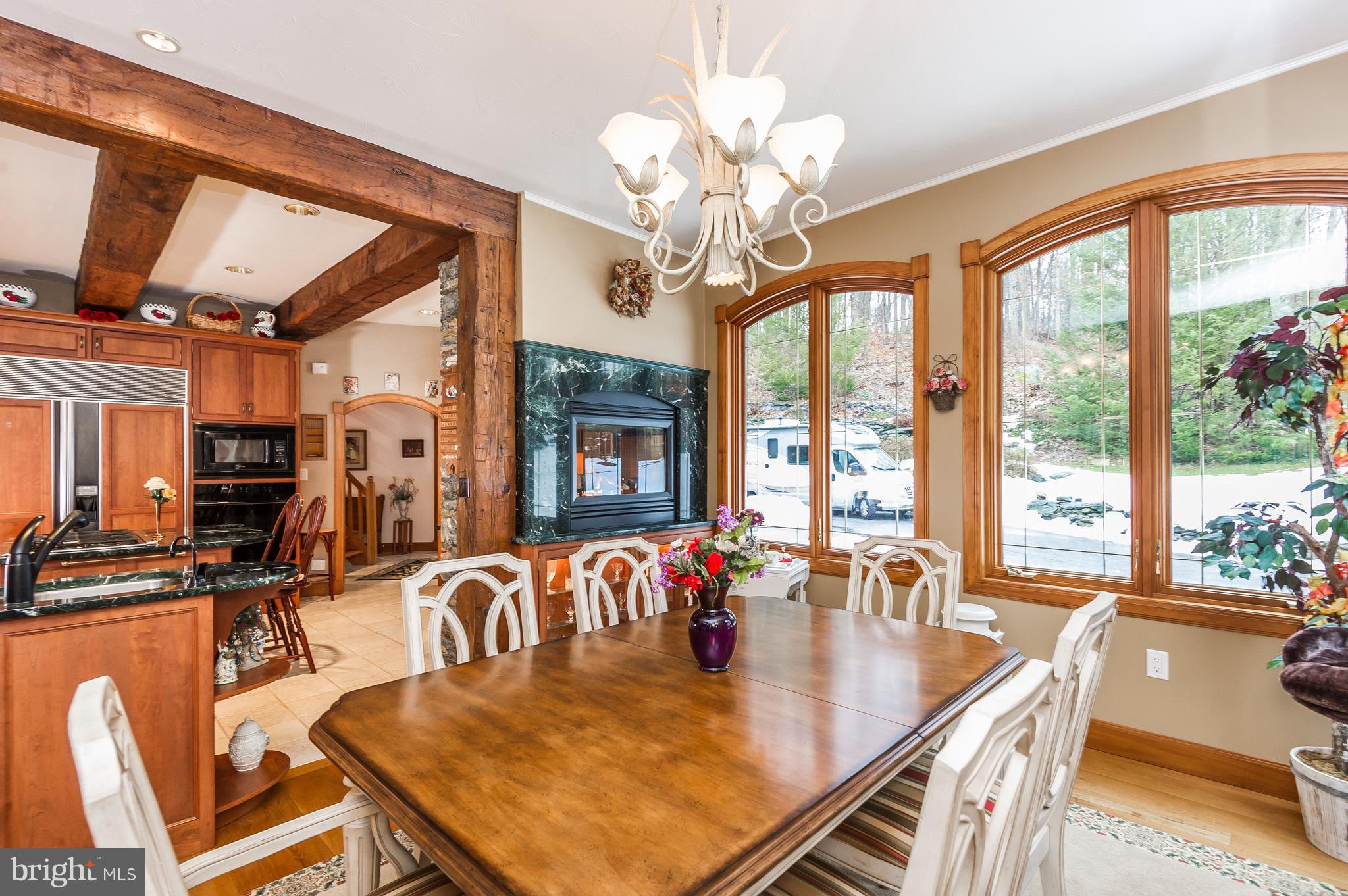 4137 Grave Run Road Manchester, MD 21102 - Photo 5 of 30 a dining room with furniture a chandelier and large windows
