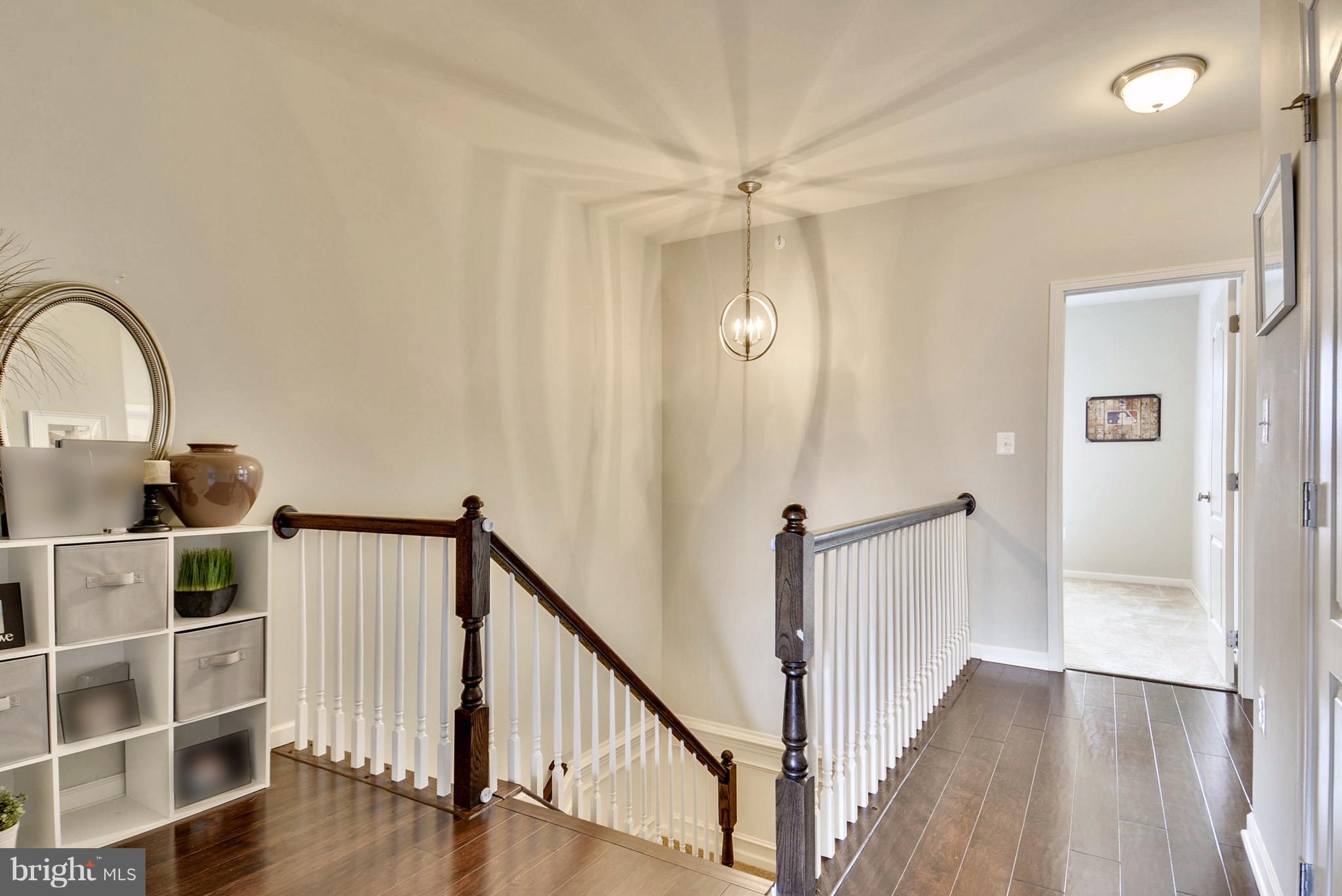 23487 Logans Ridge Terrace Ashburn, VA 20148 - Photo 10 of 27 Beautiful Hardwood Floors in Hallways