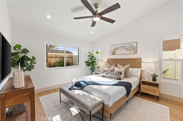 a bedroom with a bed and a potted plant