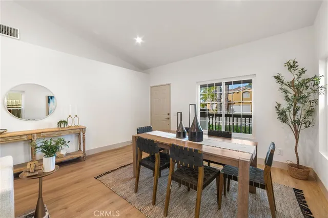 a view of a dining room with furniture and window