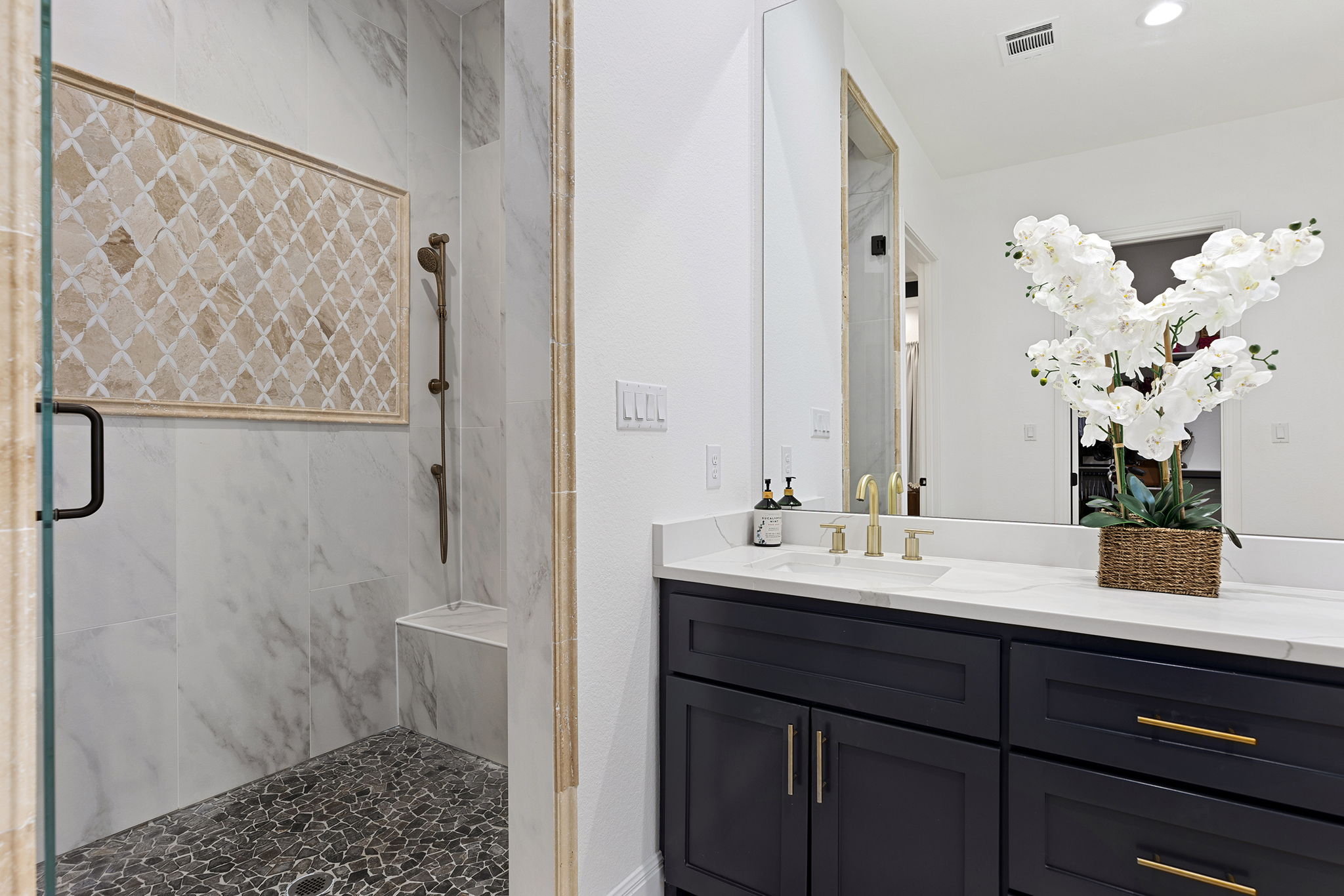 153 Fawn Hollow Elgin, TX 78621 - Photo 25 of 40 a bathroom with a double vanity sink and a mirror