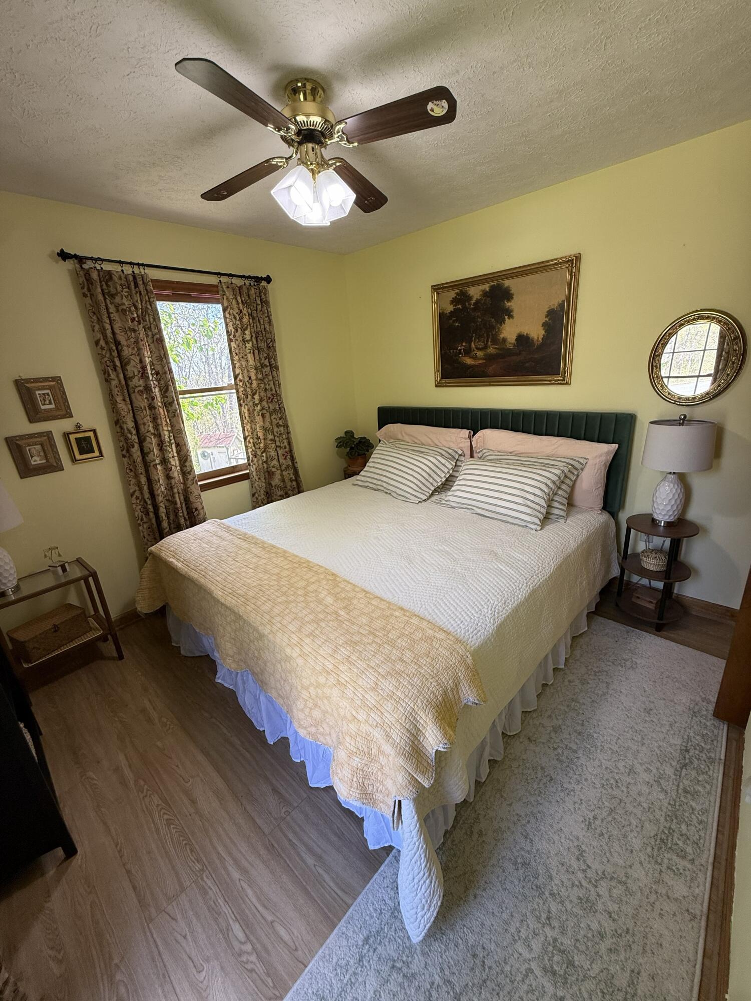 616 Dryhill Road Ferrum, VA 24088 - Photo 8 of 31 a bedroom with a bed and a chandelier