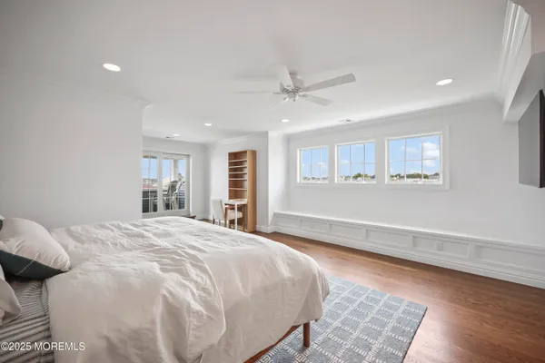 a spacious bedroom with a large bed and a window