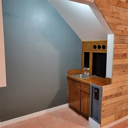 a view of a hallway with washer and dryer